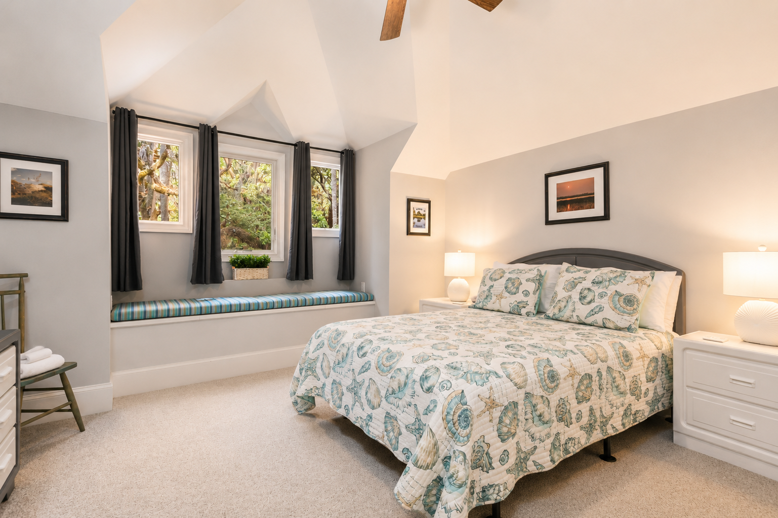 Wake up in the seashell-print bed and read on the cushioned window seat.