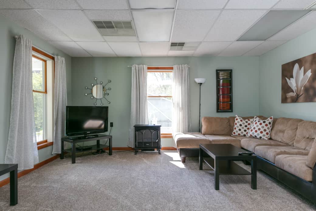 Curl up on the comfy sectional by the fireplace to watch TV and relax!