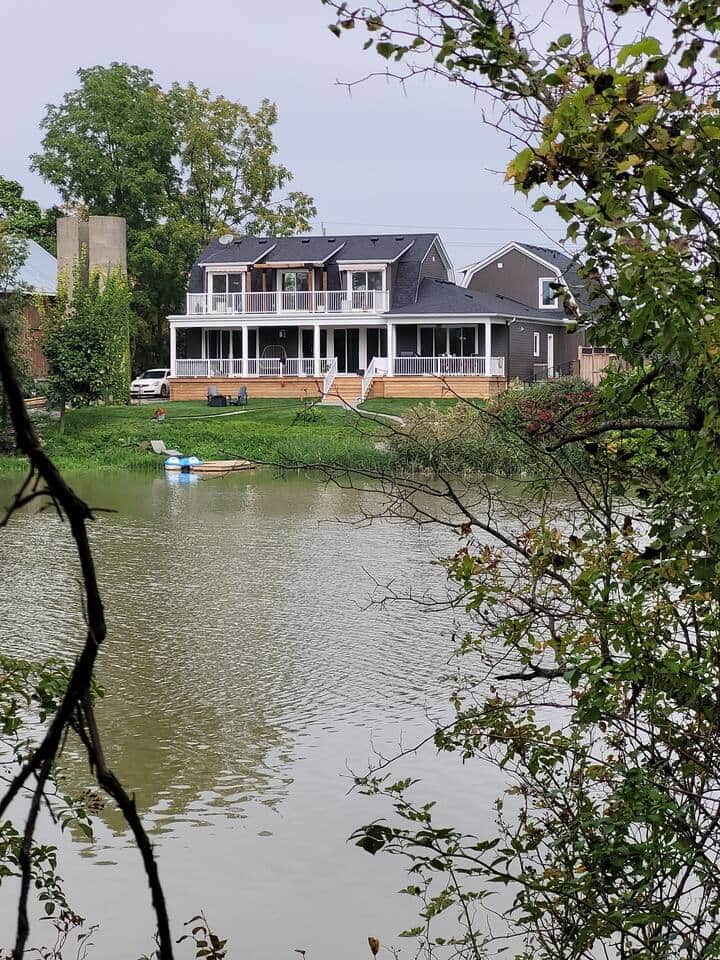 pic of house from nature trail across the water