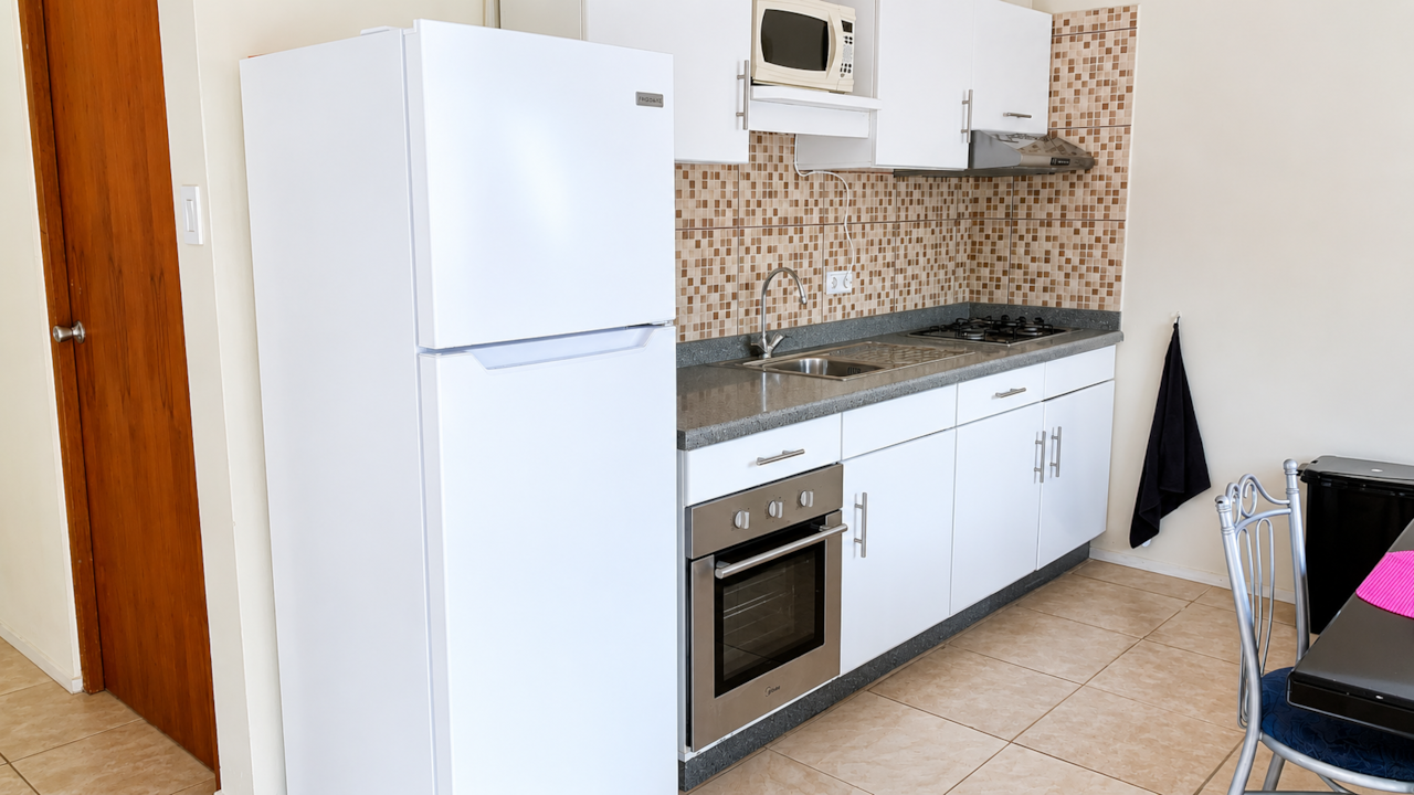 Fully equipped kitchen with a Fridge, Coffee maker, water kettle, oven, stove, pots & pans, utensils