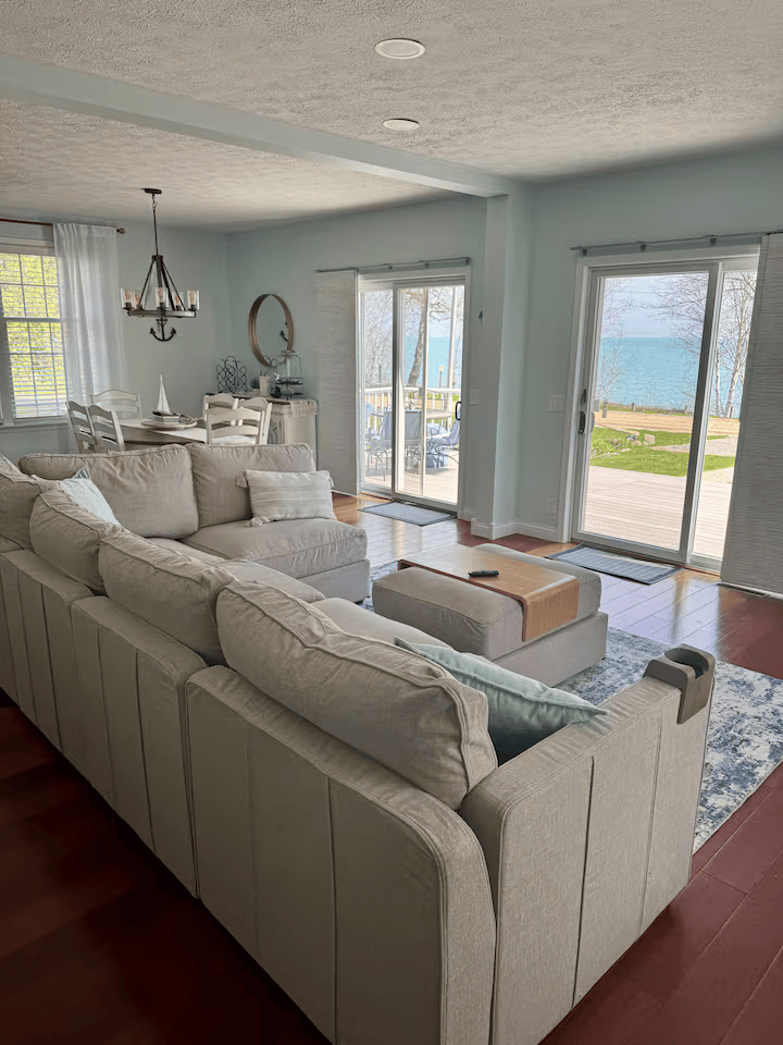 Airy living room with large windows and nautical accents 