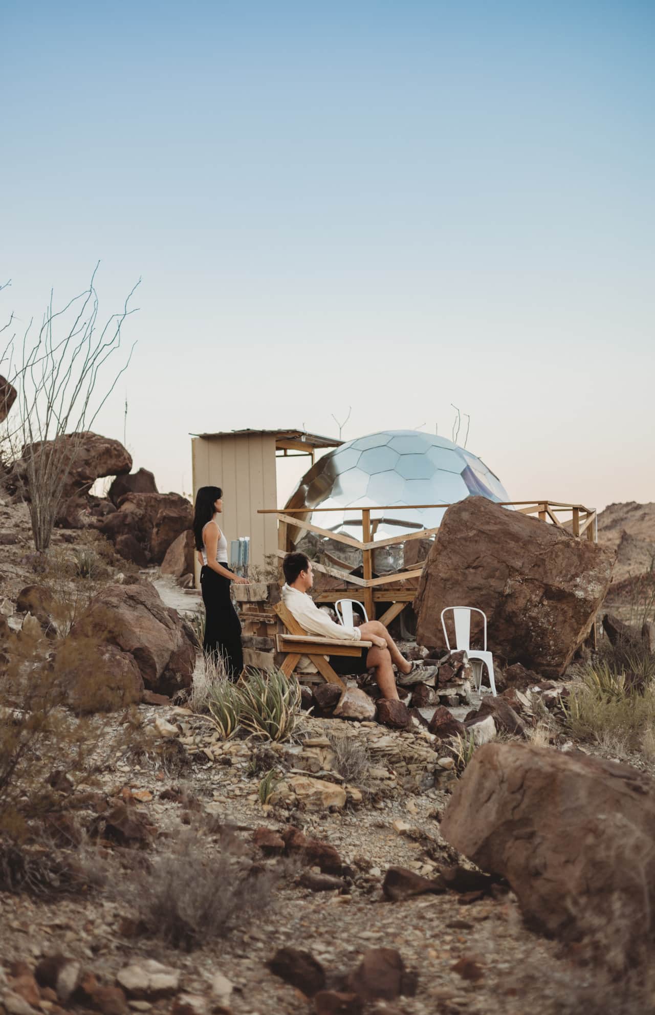 Space Pod 007 geodesic dome among the desert boulders