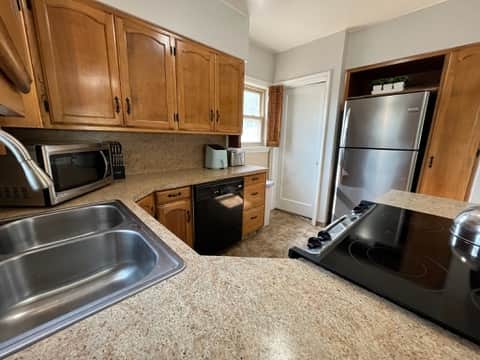 Fully stocked kitchen with modern appliances and plenty of counter space.