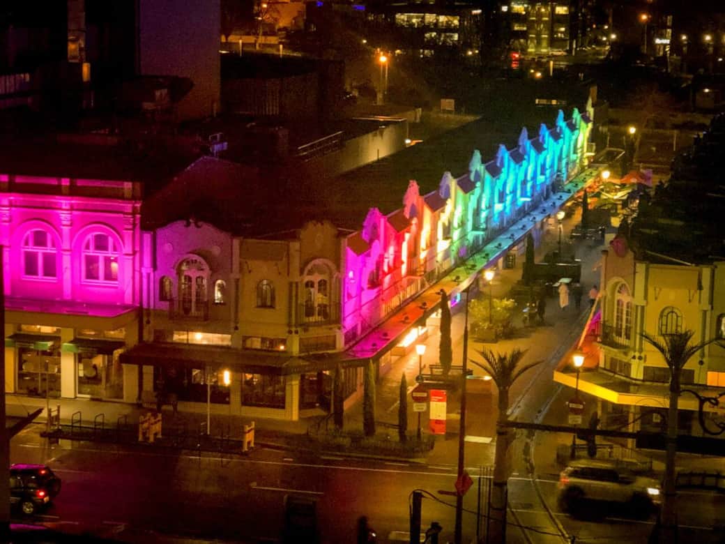 View from apartment window looking down New Regent street at night