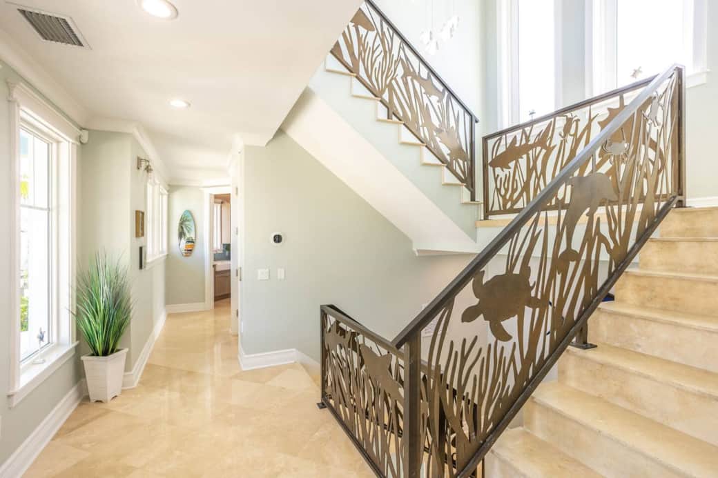 2nd story landing - bedroom floor showcasing underwater-themed custom stair rails