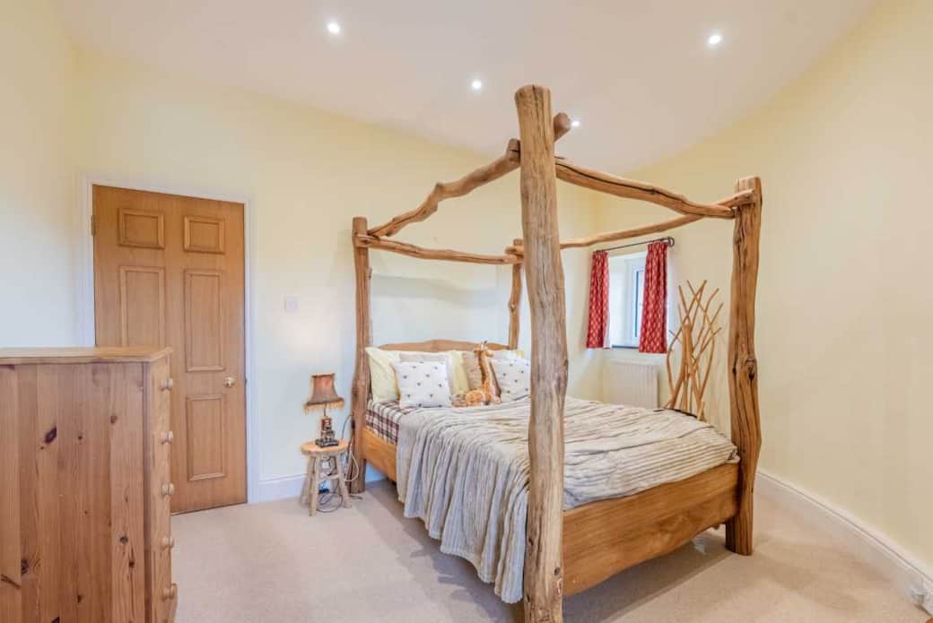 This fairy tale bed constructed from raw oak tree branches can comfortably sleep 2 This fairy tale bed constructed from raw oak tree branches can comfortably sleep 2