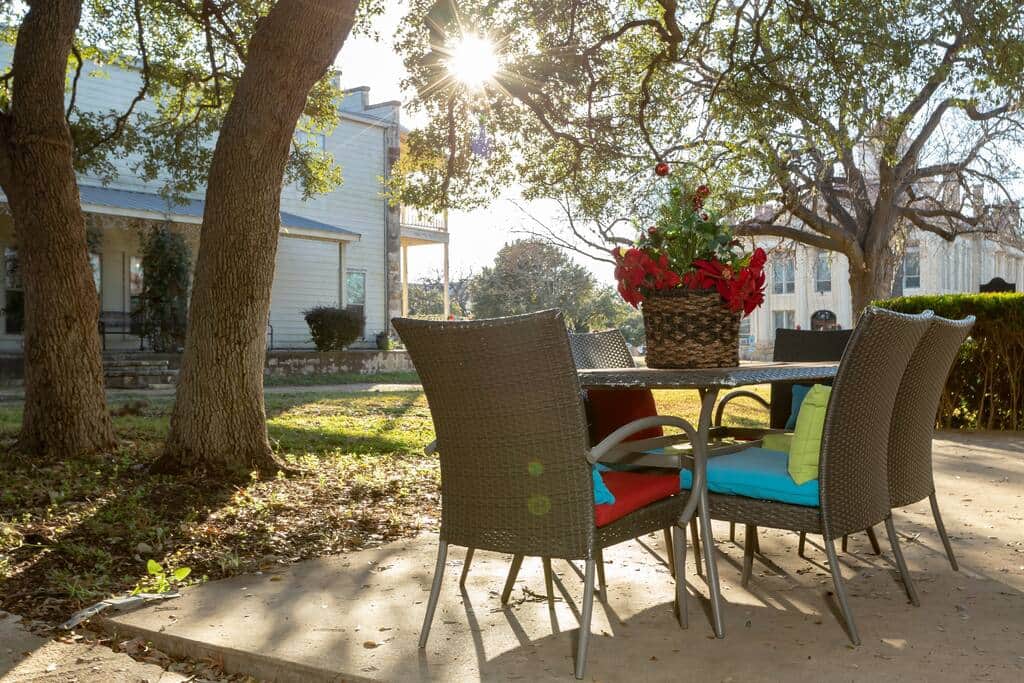 Relax on the patio under the shade of the oak trees