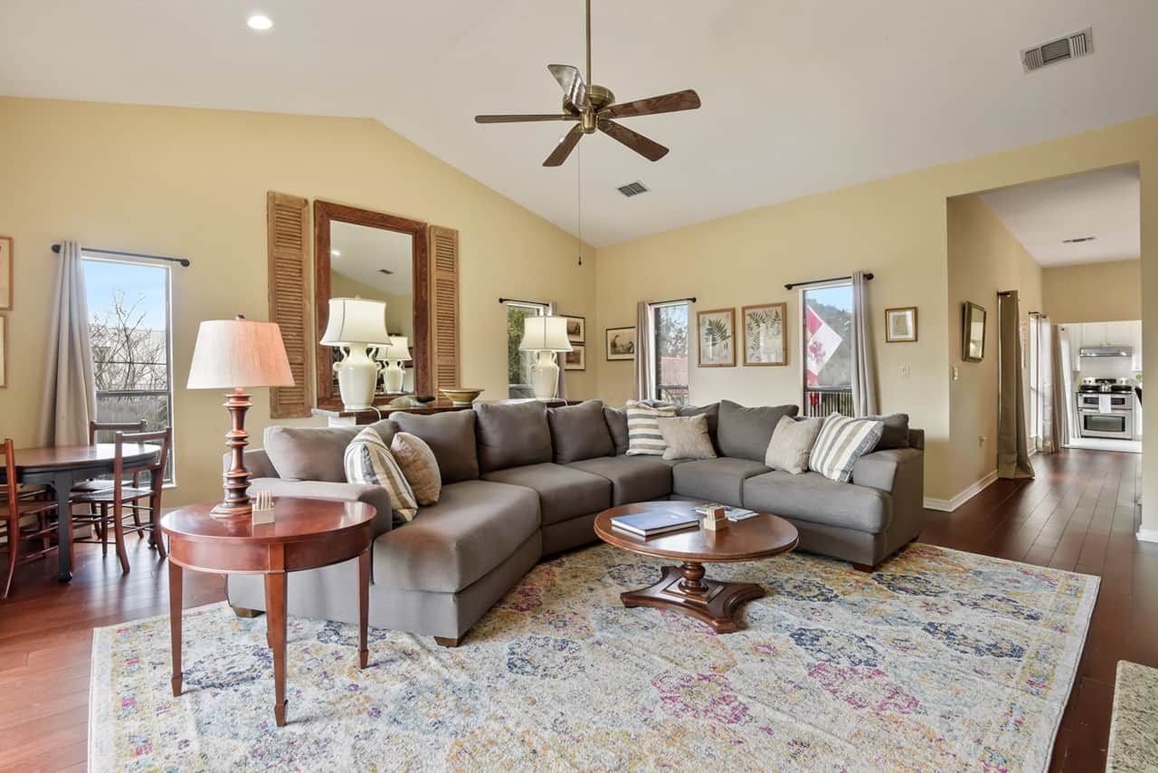 Another view of the living room, dining room, and entrance to the kitchen. 