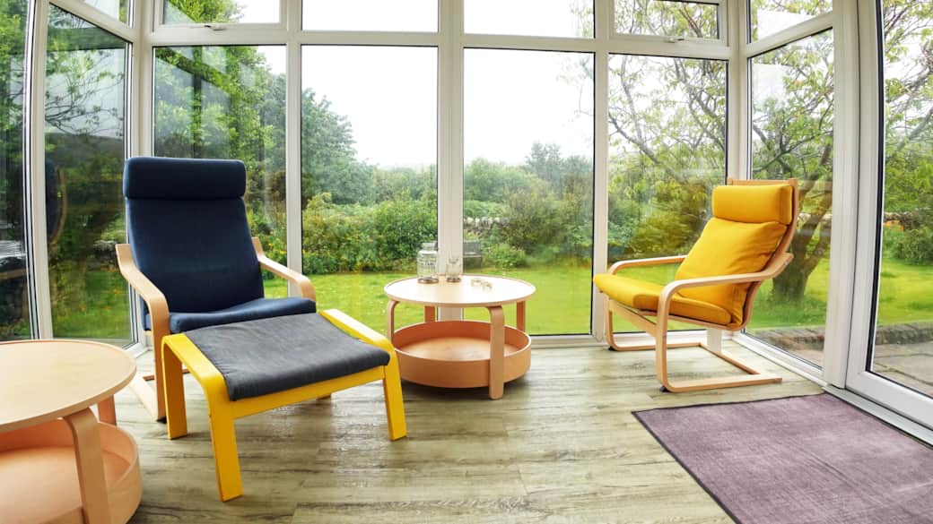 The conservatory provides a peaceful, cozy space ideal for meditation, relaxation, or quality time.