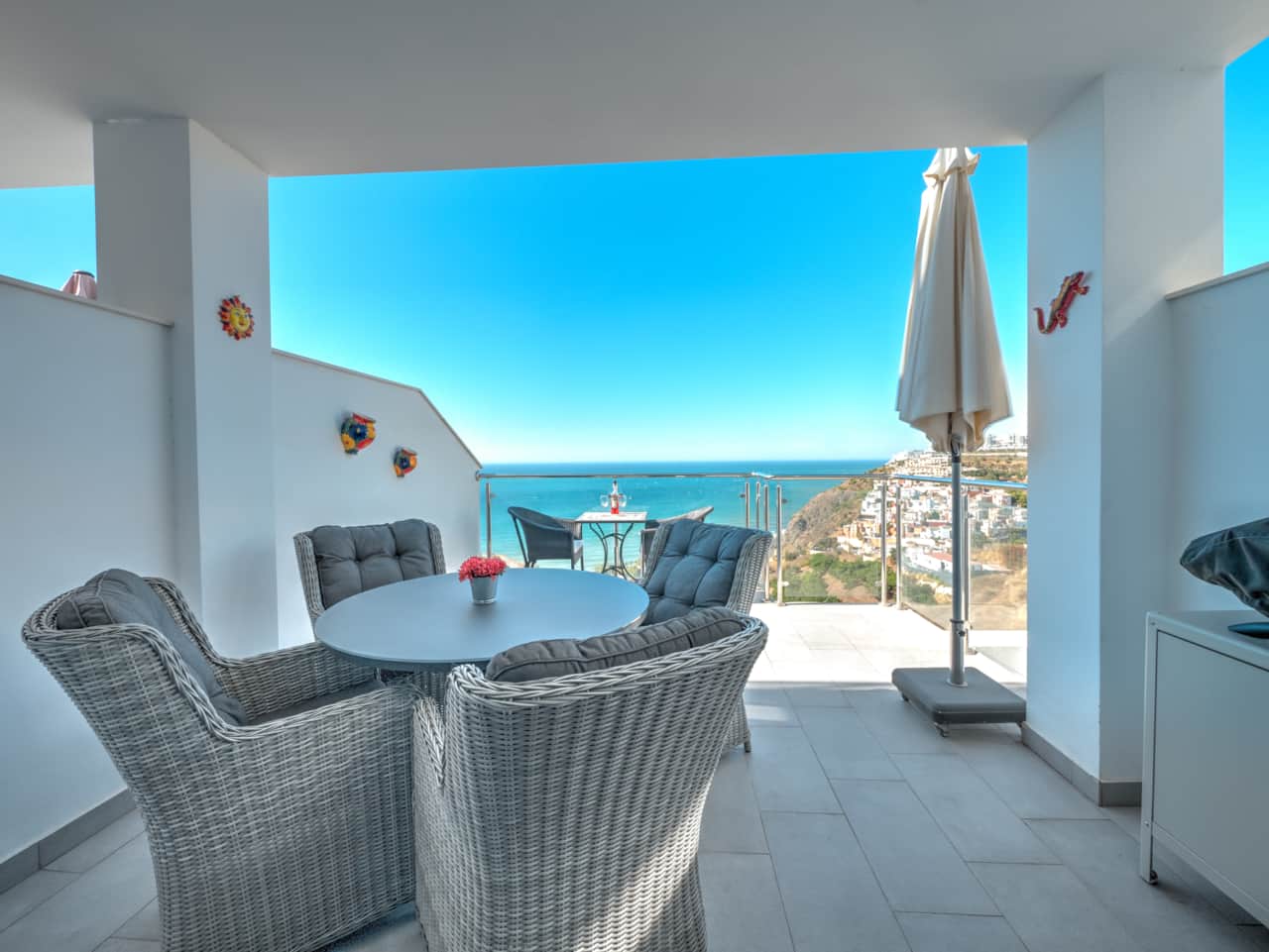 The balcony off the living room with seating and stunning views.