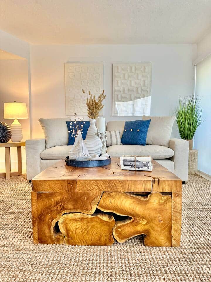 Spacious and stylish living room with a large-screen TV and inviting coastal decor

