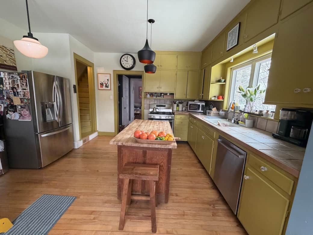 Light-filled kitchen with a back door leading to the garden.