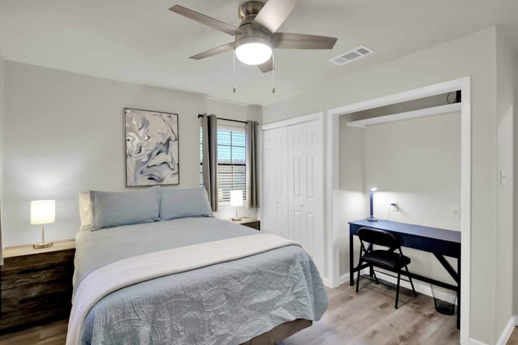 The second bedroom features a built-in work area.