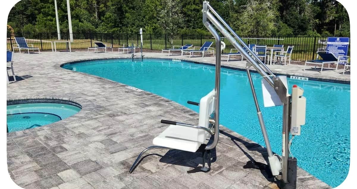 A pool lift is pictured beside the shared swimming pool at Pecan Park RV Resort.