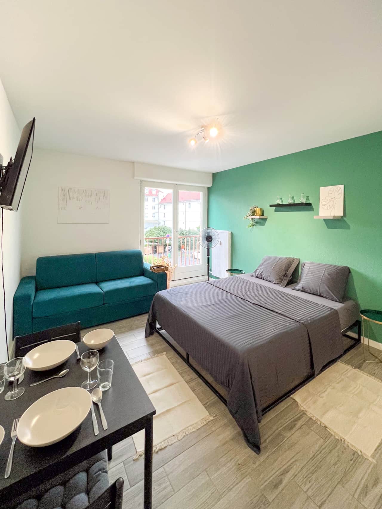 Studio with a large bed and comfortable sofa and fully equipped kitchen