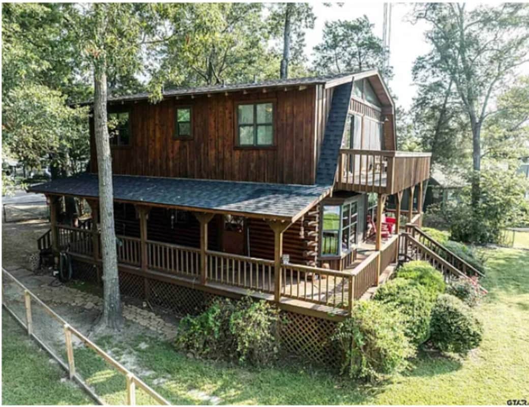 Beautiful wraparound covered porch and upper balcony