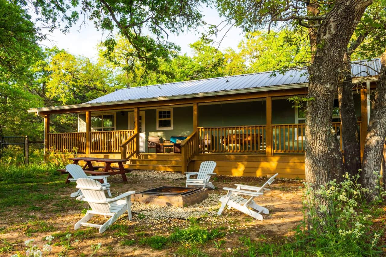 Fenced backyard with firepit and amazing porch