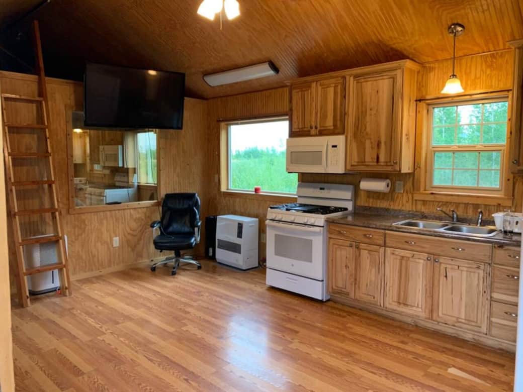 Full kitchen stocked with plates, silverware, etc.