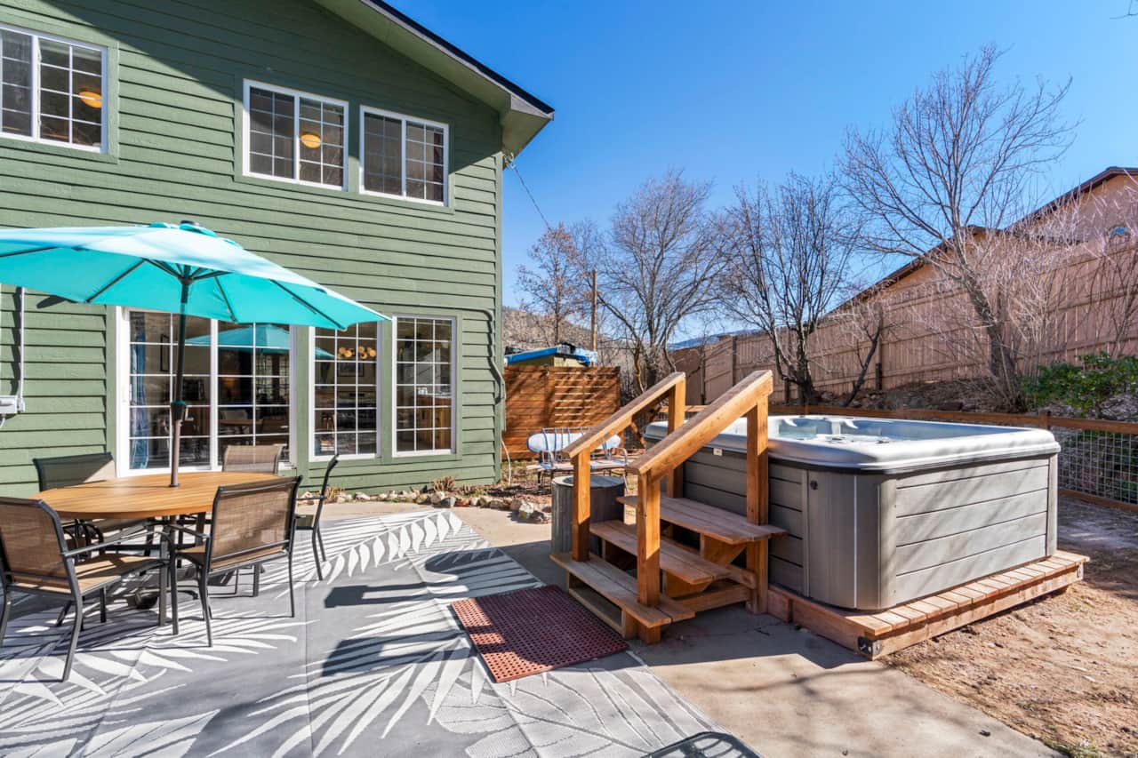 Outdoor dining table and 8-person hot tub