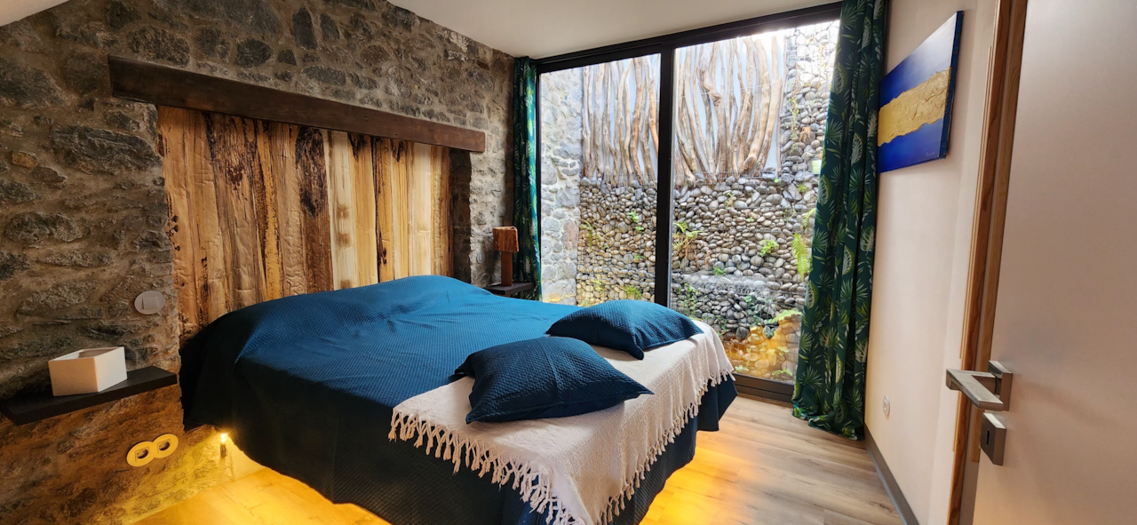 Stone walls, suspended bed — your serene bedroom sanctuary