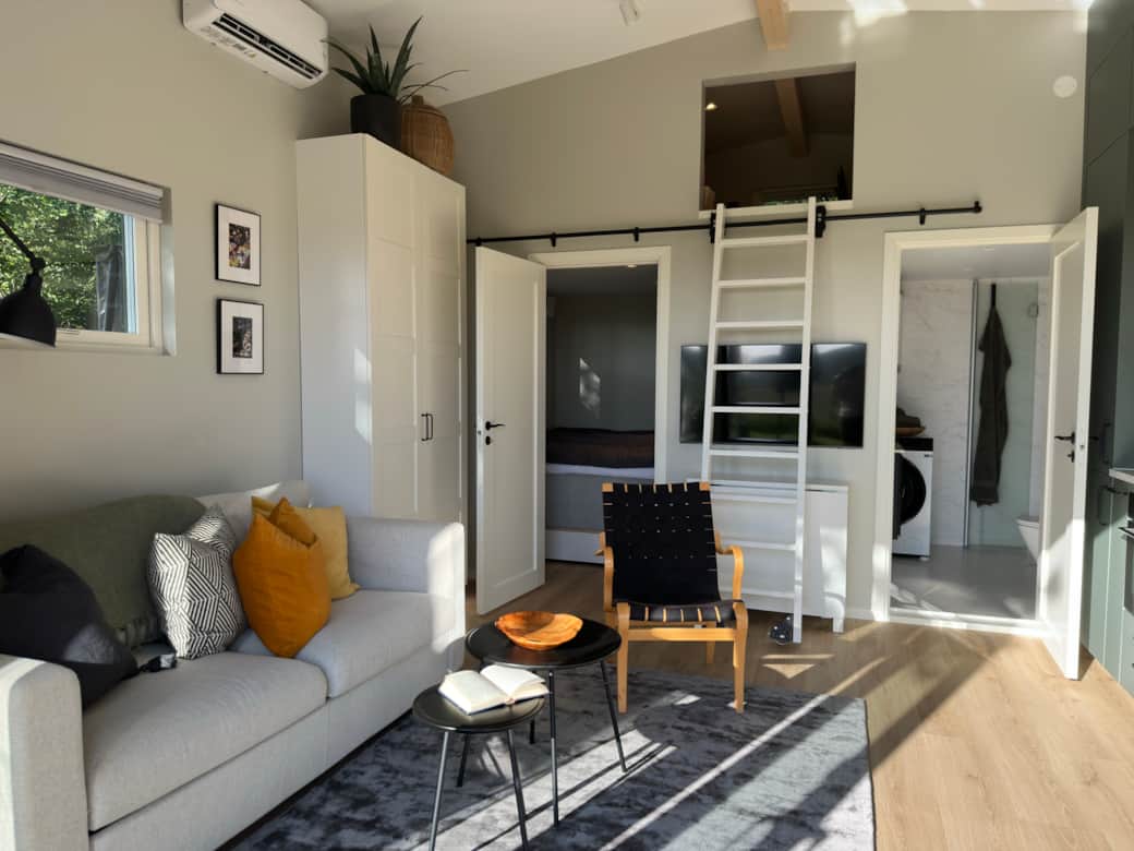 Livingroom with a ladder to the loft