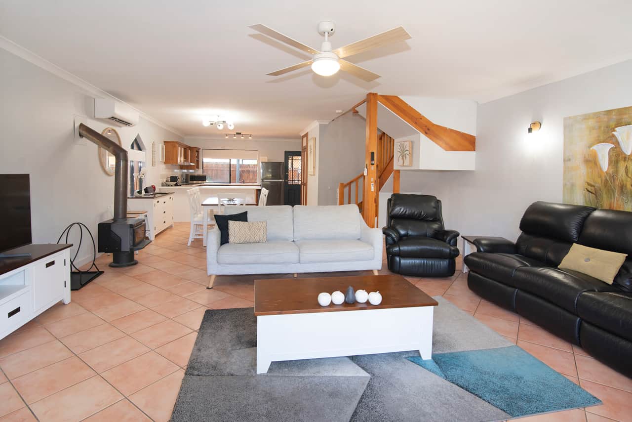 Living room with wood fire place and AC