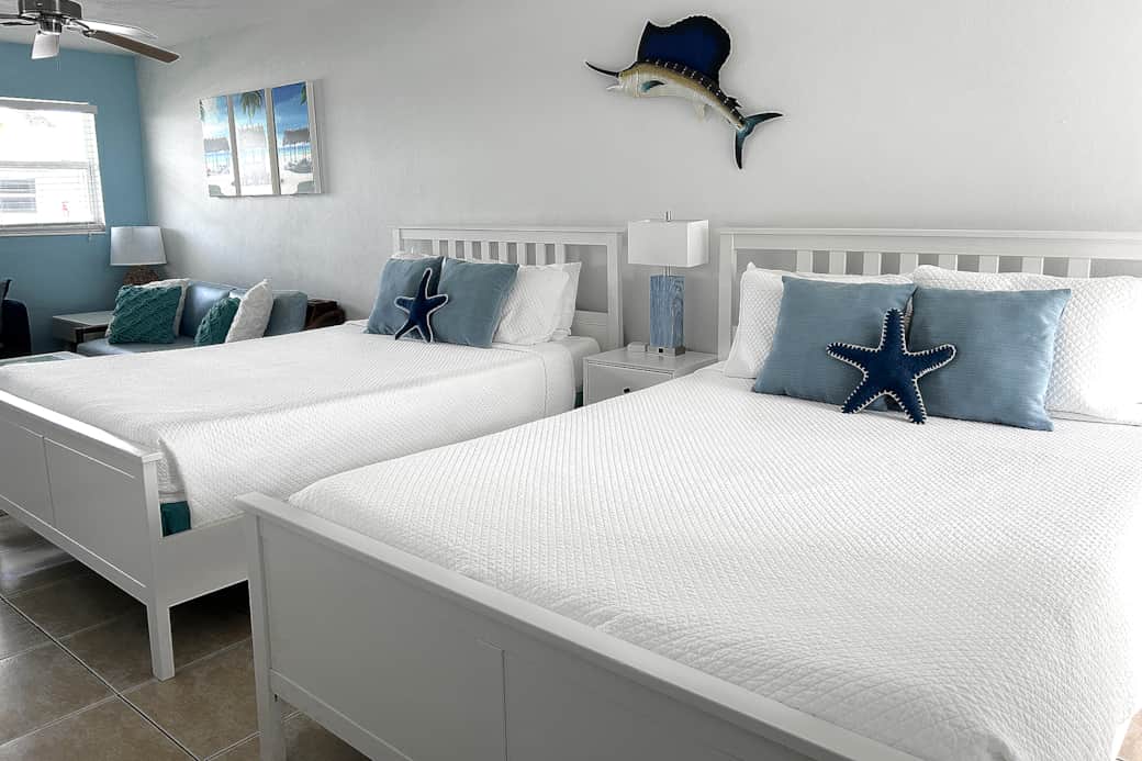 Two comfy queen beds with 100% cotton sheets and linens