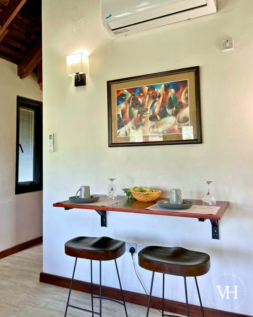 Living area features a cozy dining area for two.