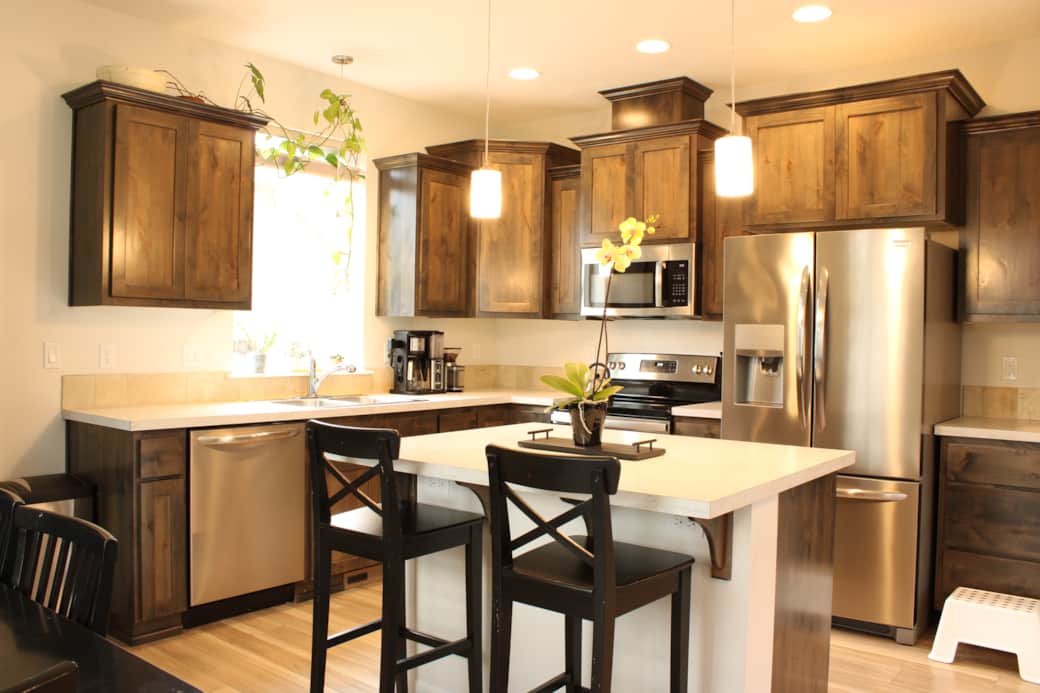 Cook and gather in a fully equipped kitchen featuring stainless steel appliances, custom cabinetry, Cook and gather in a fully equipped kitchen featuring stainless steel appliances, custom cabinetry,