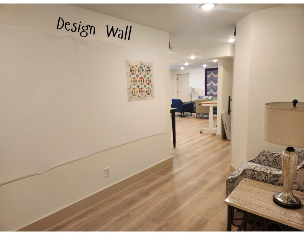 Design Wall: A large design wall makes planning easy, with a comfortable chair for taking it all in.