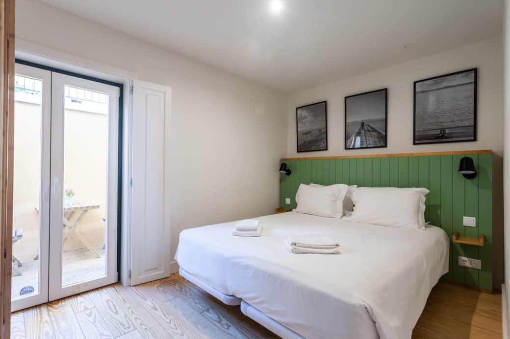 Queen sized bed with aircon, bedside lamps, bedside table, plugs and usb connection