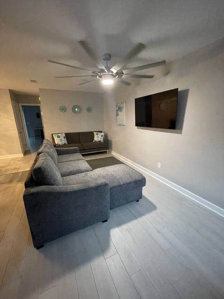 Comfy living room with lots of seating and large smart TV