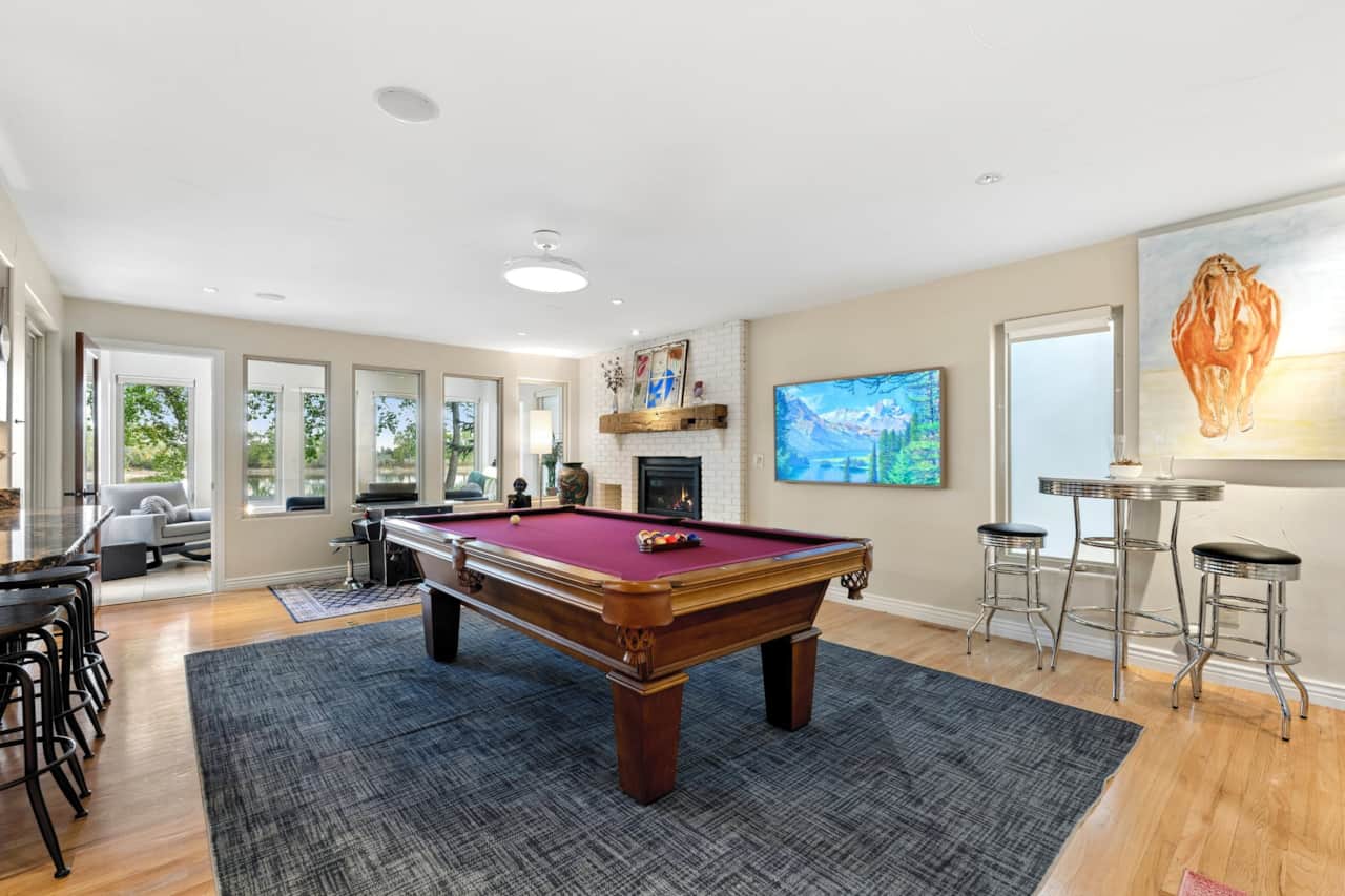 Game room — regal red billiards table and classic arcade