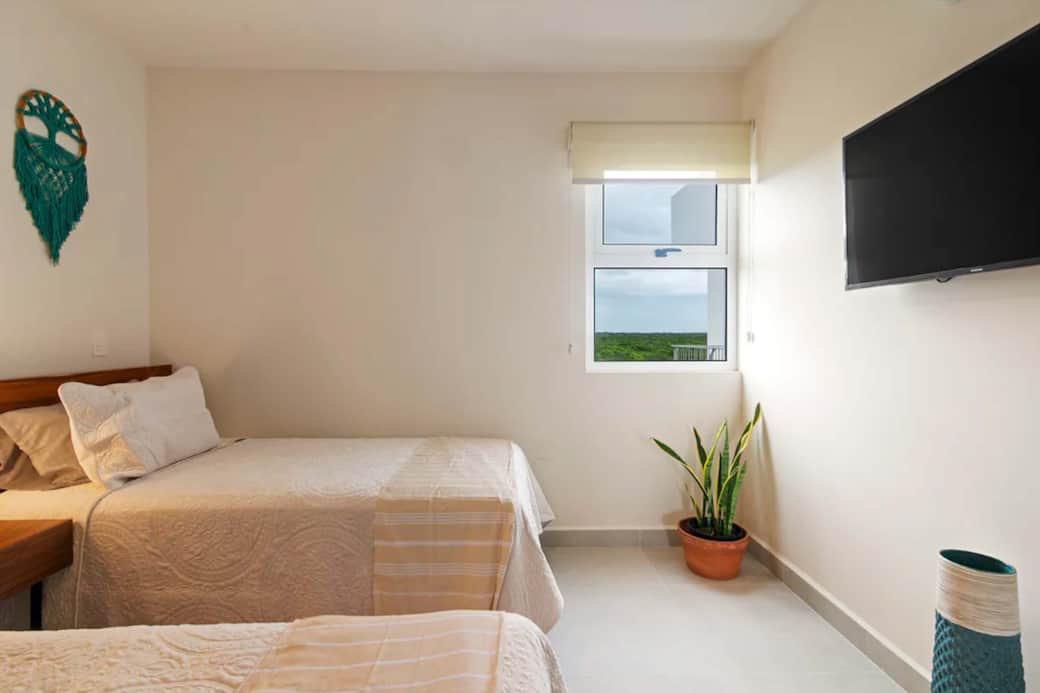 Double comfort, views: Two beds, smart TV, lush jungle scenery outside window, tranquility