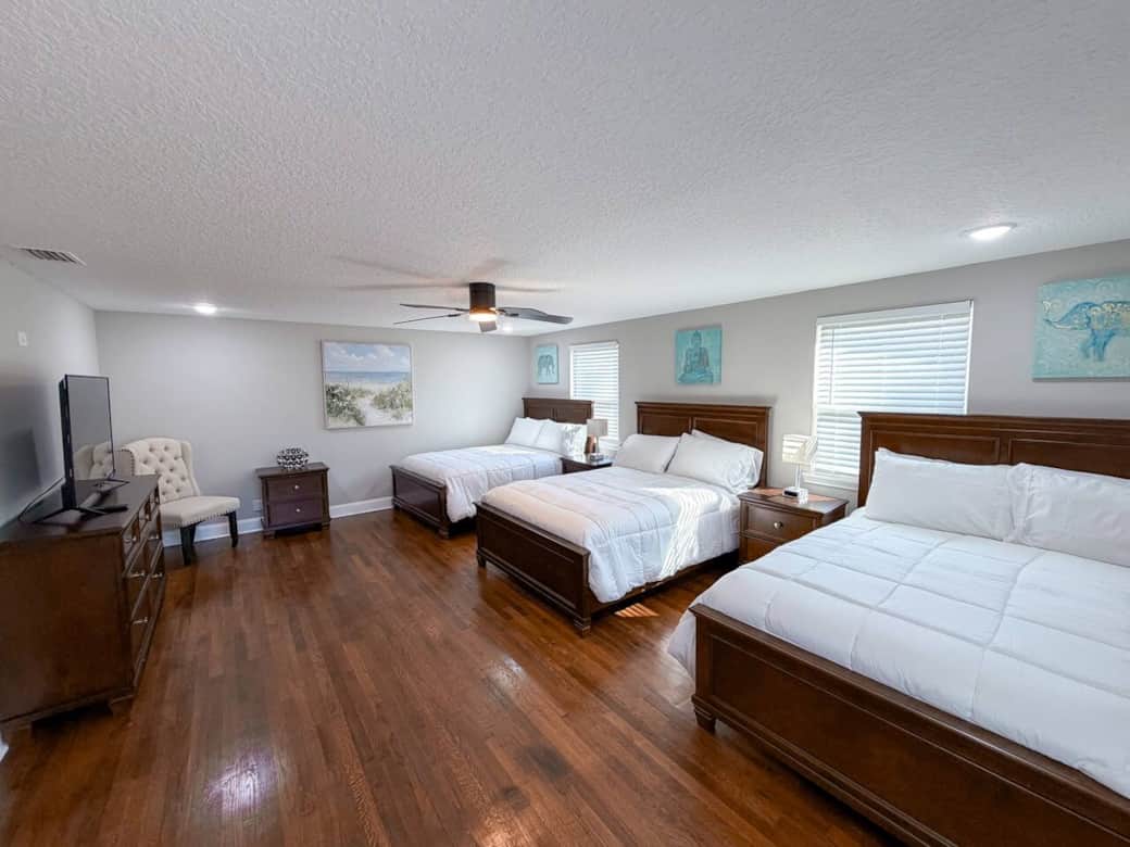 Mia Room - This spacious bedroom features 3 full-size beds, a walk-in closet, and a smart TV.