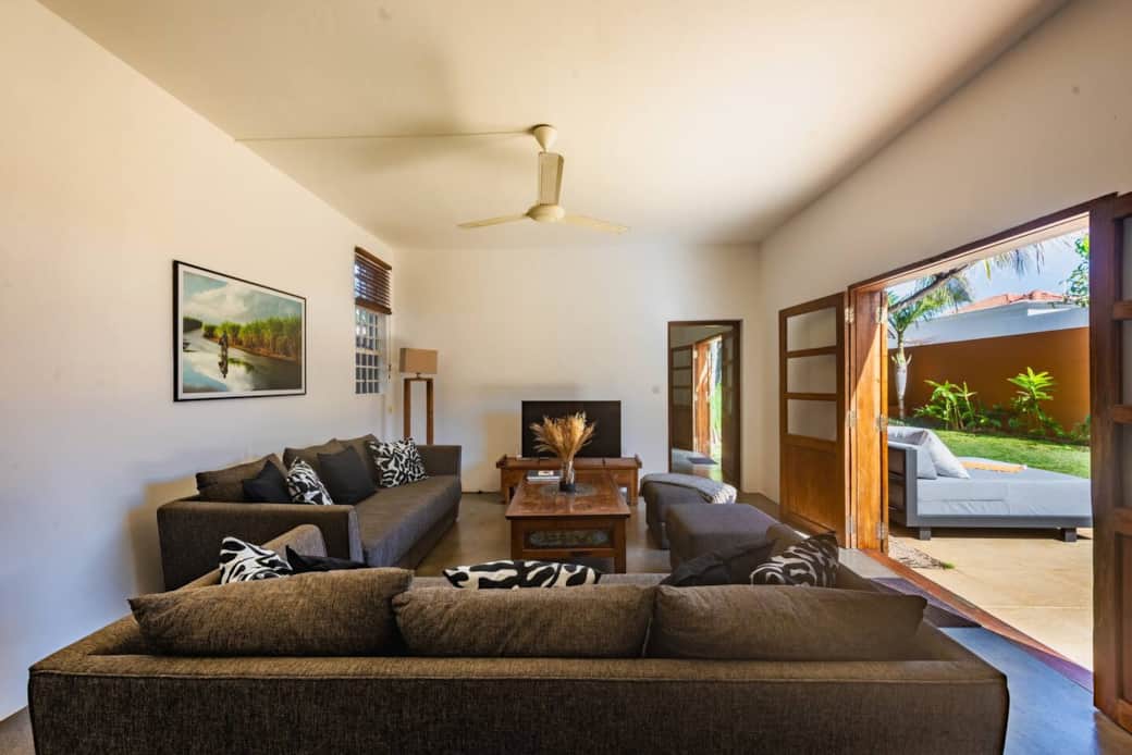 Bright, spacious living room with view on the garden and pool plus a cozy TV area for evenings Bright, spacious living room with view on the garden and pool plus a cozy TV area for evenings