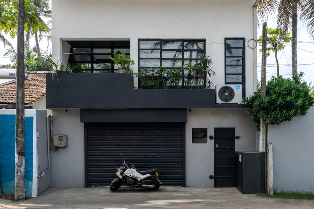Front of the building. The black gate is your entrance.