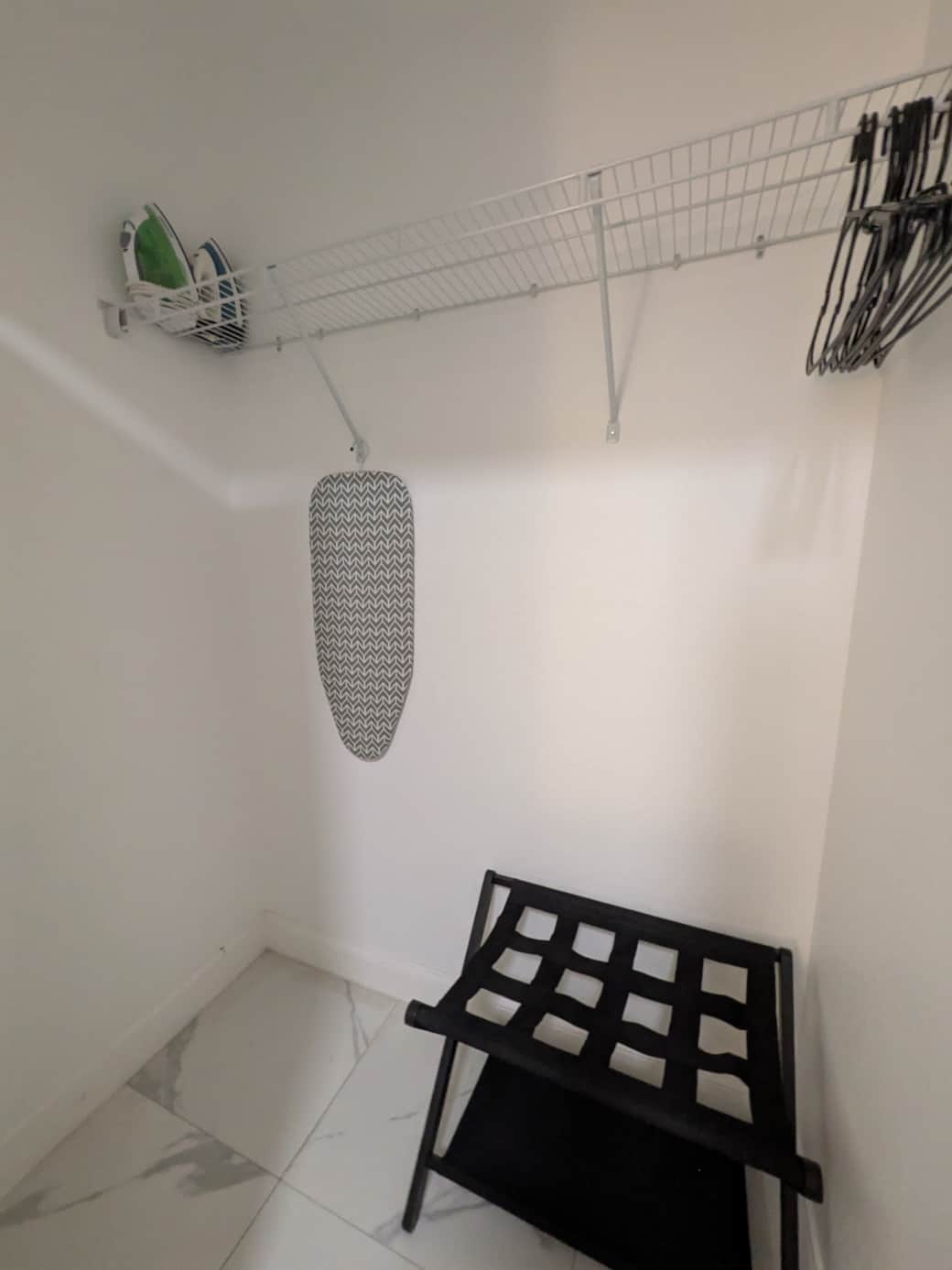 Bedroom 2: Walk-in closet with iron & luggage rack.