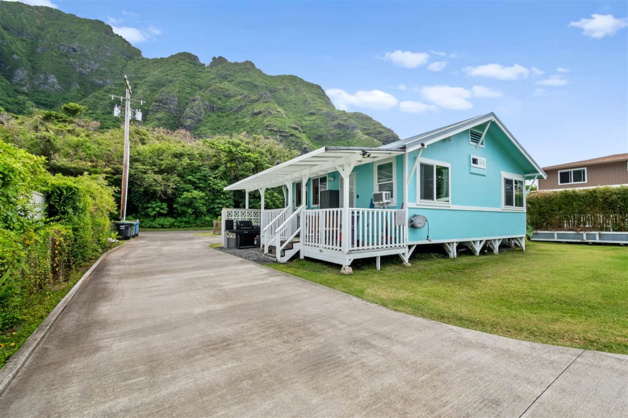 Front lawn and wraparound white deck