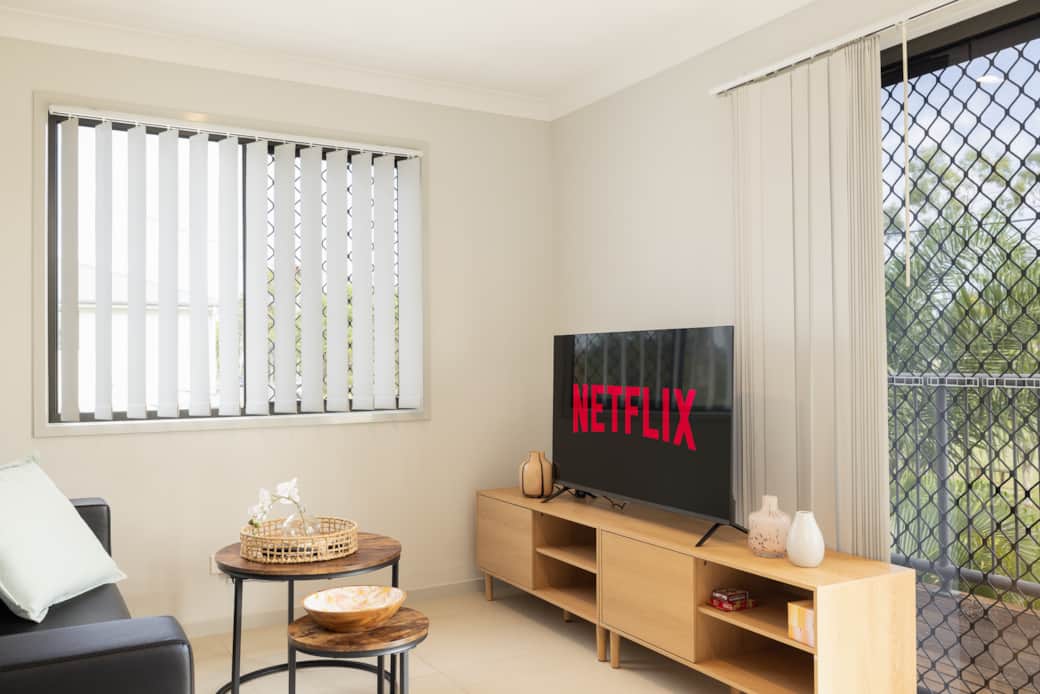 Living Area: Bright living space with comfortable seating and TV