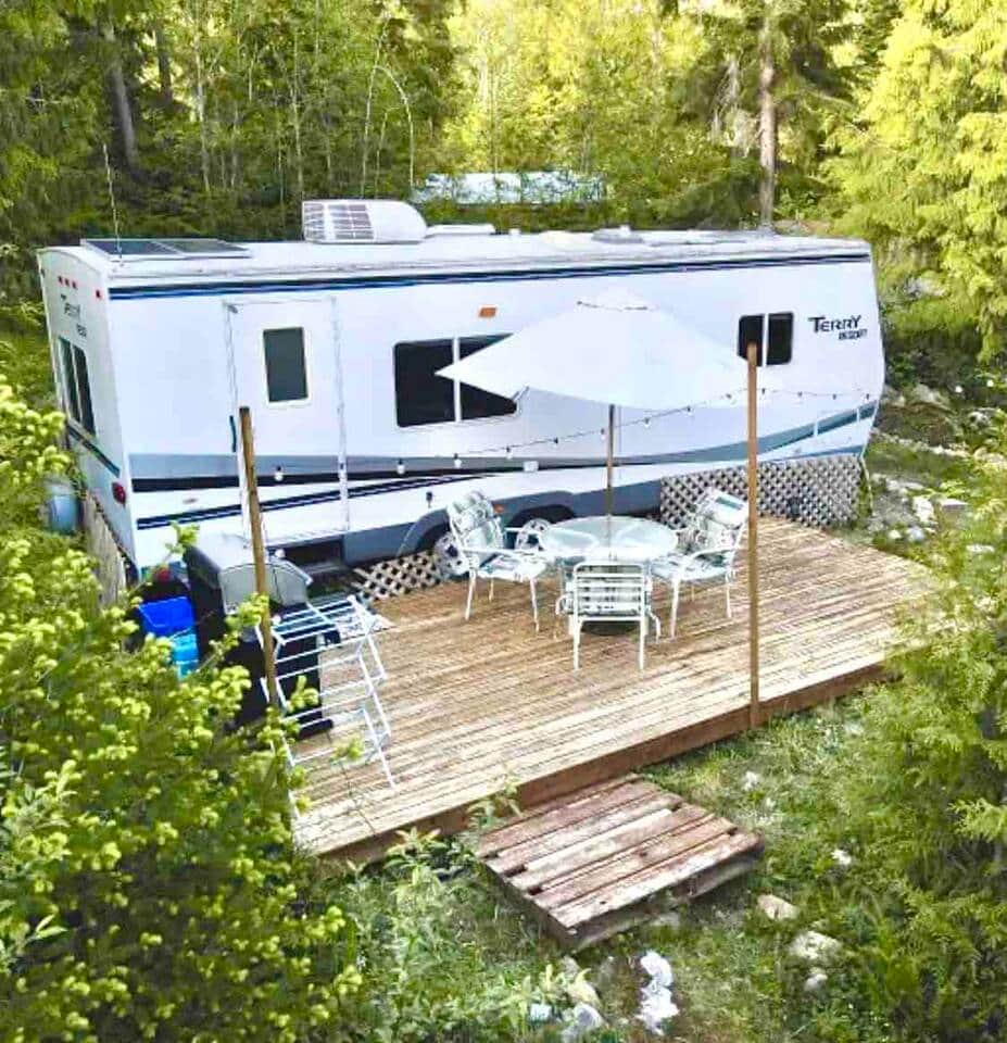 Large deck which faces the ocean view through the trees Large deck which faces the ocean view through the trees
