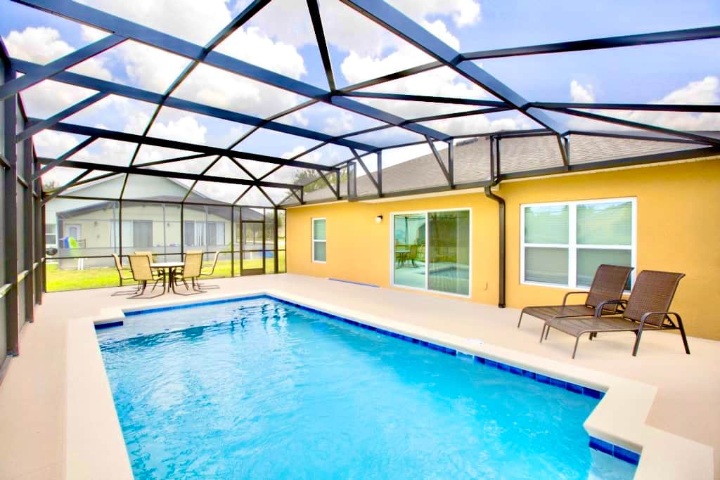 Plenty of space around the pool for sitting and relaxing on deck furniture provided