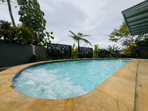 Jacuzzi on side of pool Jacuzzi on side of pool