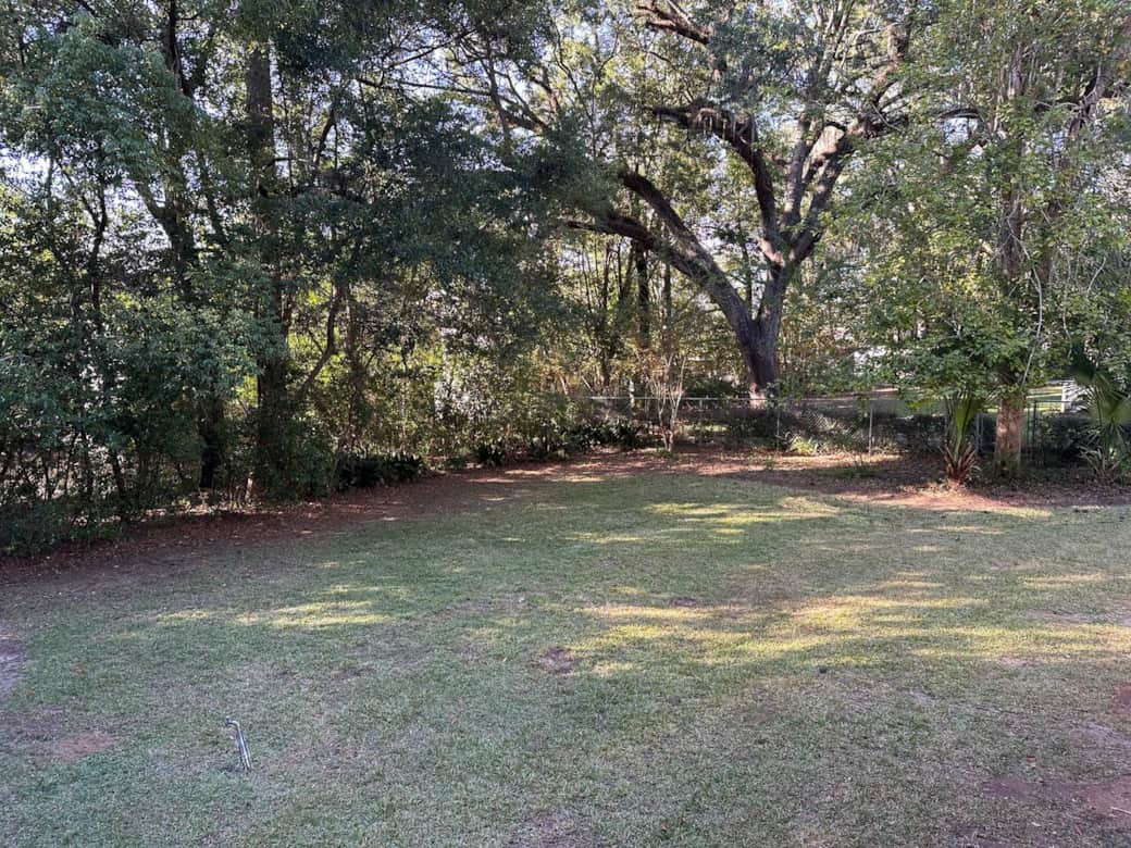 Located on 1/2 acre. Large tree lined back yard.