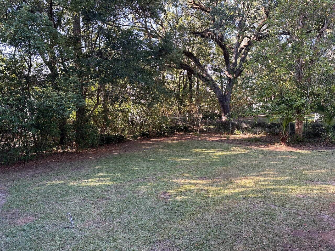 Located on 1/2 acre. Large tree lined back yard.