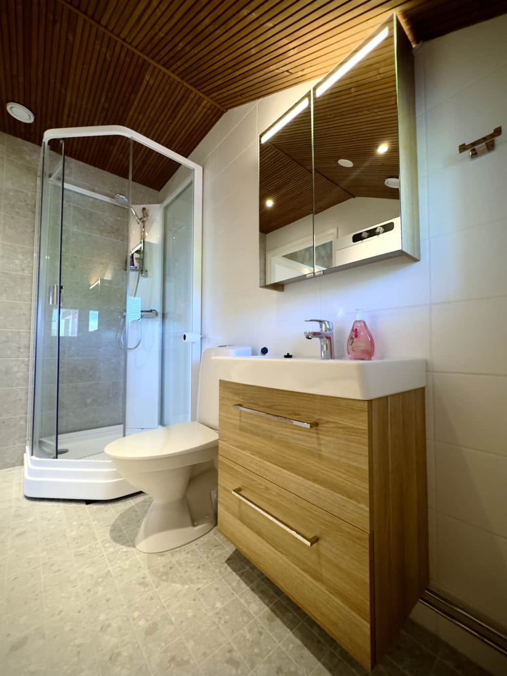 The bathroom is spacious, equipped with a shower cubicle and a drying cabinet. The bathroom is spacious, equipped with a shower cubicle and a drying cabinet.