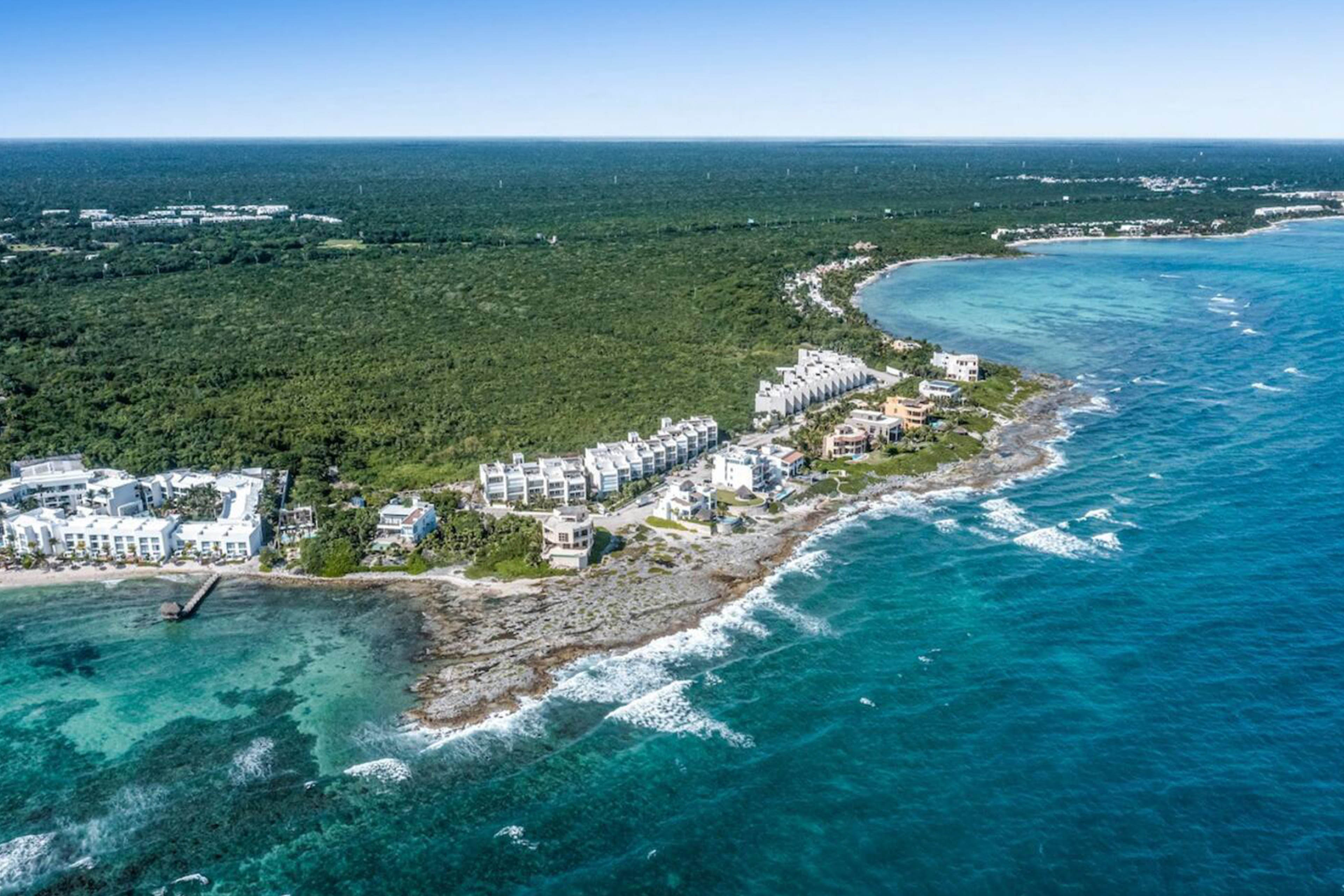 Private beach access just steps away, where soft sand, turquoise waters, and ocean breezes await.