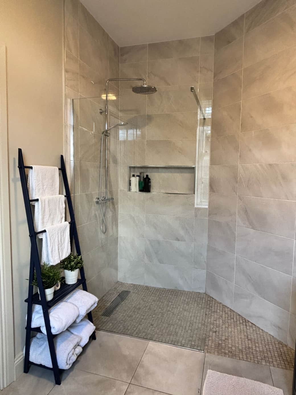 Walk-in shower and soft white towels Walk-in shower and soft white towels