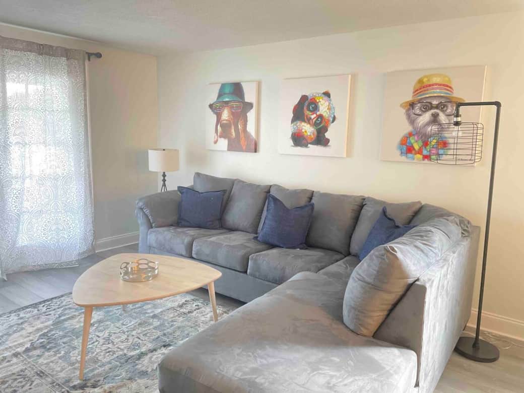 Oversized sofa for cozy movie nights, with French doors opening to the outdoor living spa