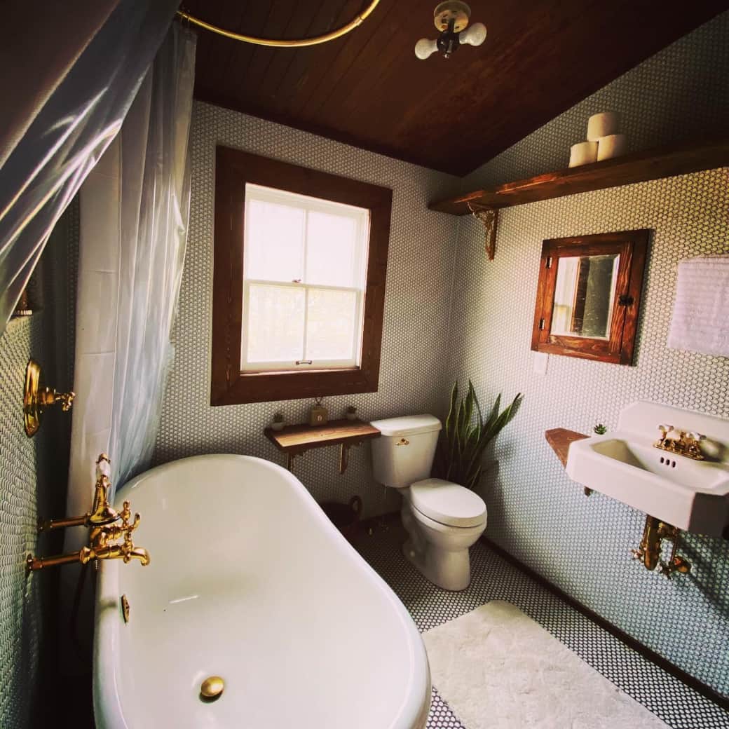 East Side Bathroom Featuring Vintage Farmhouse Sink, Barn Metal Ceiling, Clawfoot Tub & Rain Shower East Side Bathroom Featuring Vintage Farmhouse Sink, Barn Metal Ceiling, Clawfoot Tub & Rain Shower